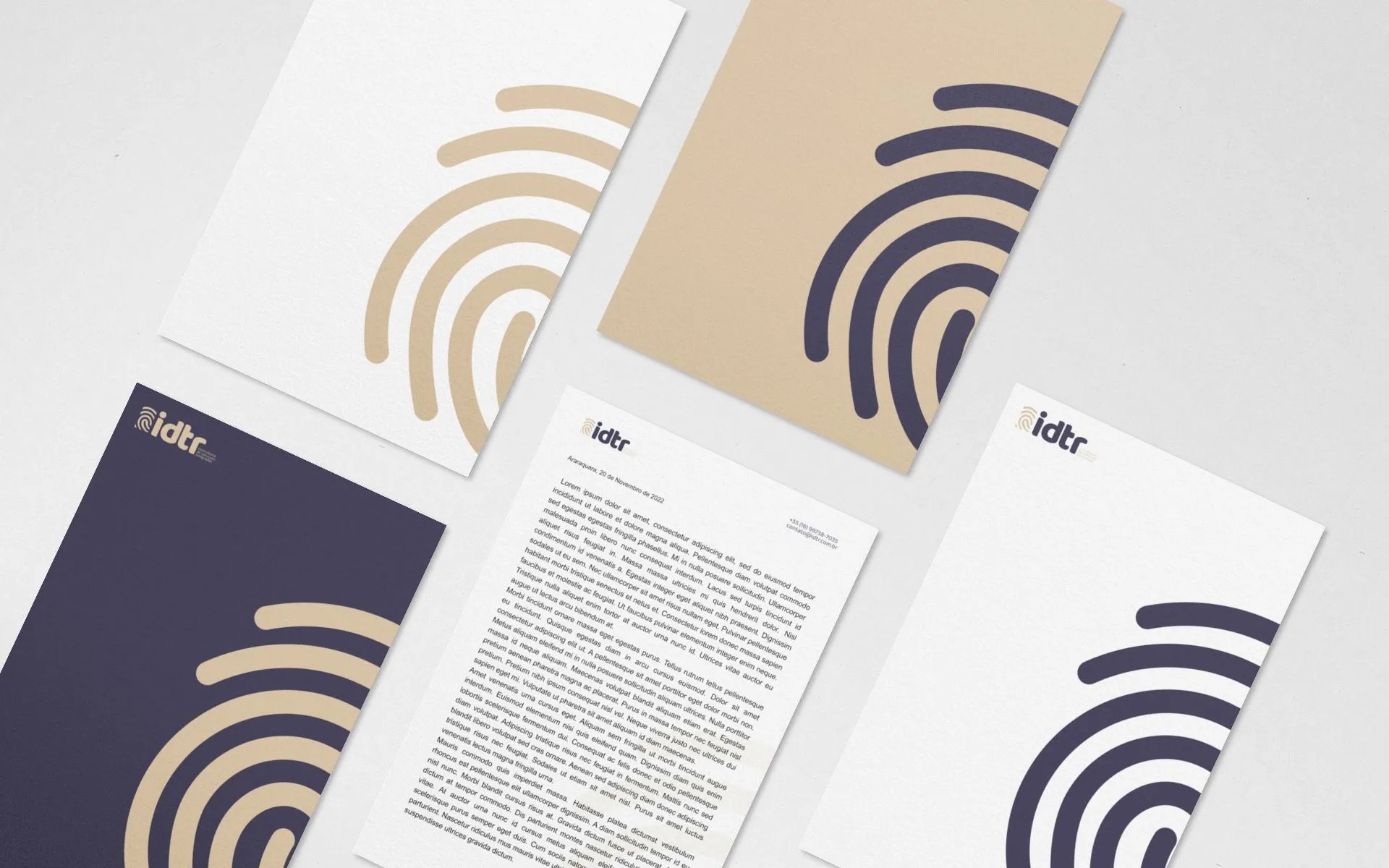Folhas de papel timbrado da IDTR em três versões: lilás, dourada e branca.